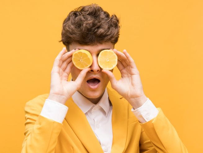 a man plays with lemons